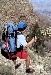 Backpacker pauses to check progress.  Red Canyon (New Hance) Trail.  Grand Canyon National Park.  (c) Rob Kleine, All Rights Reserved.  www.gentleye.com